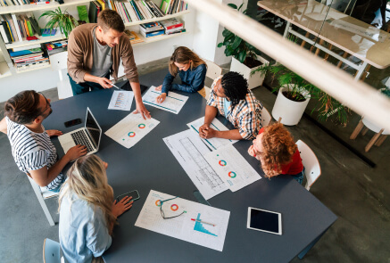 A group of people discussing salesÂ
